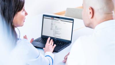 Two examiners looking at the Guidelines webpage
